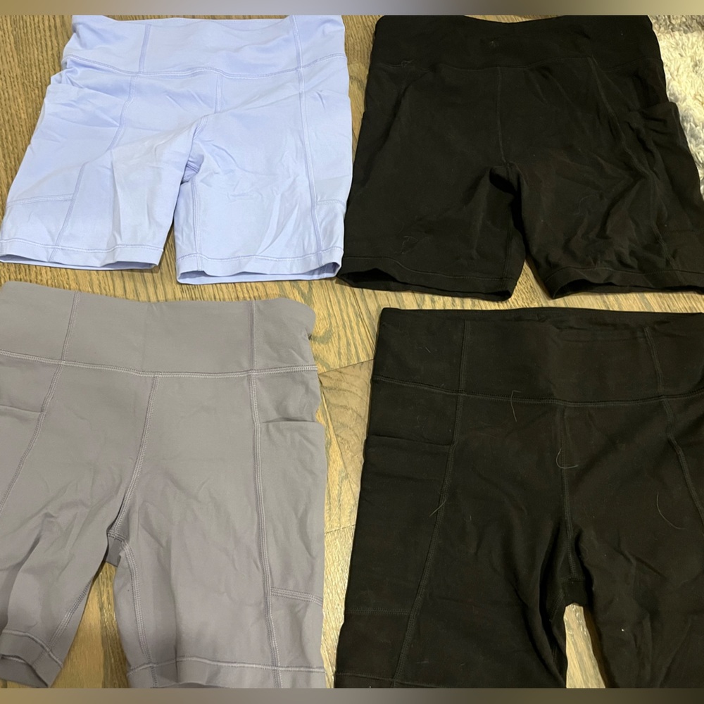 Four pairs of barely worn girls Athleta biker shorts